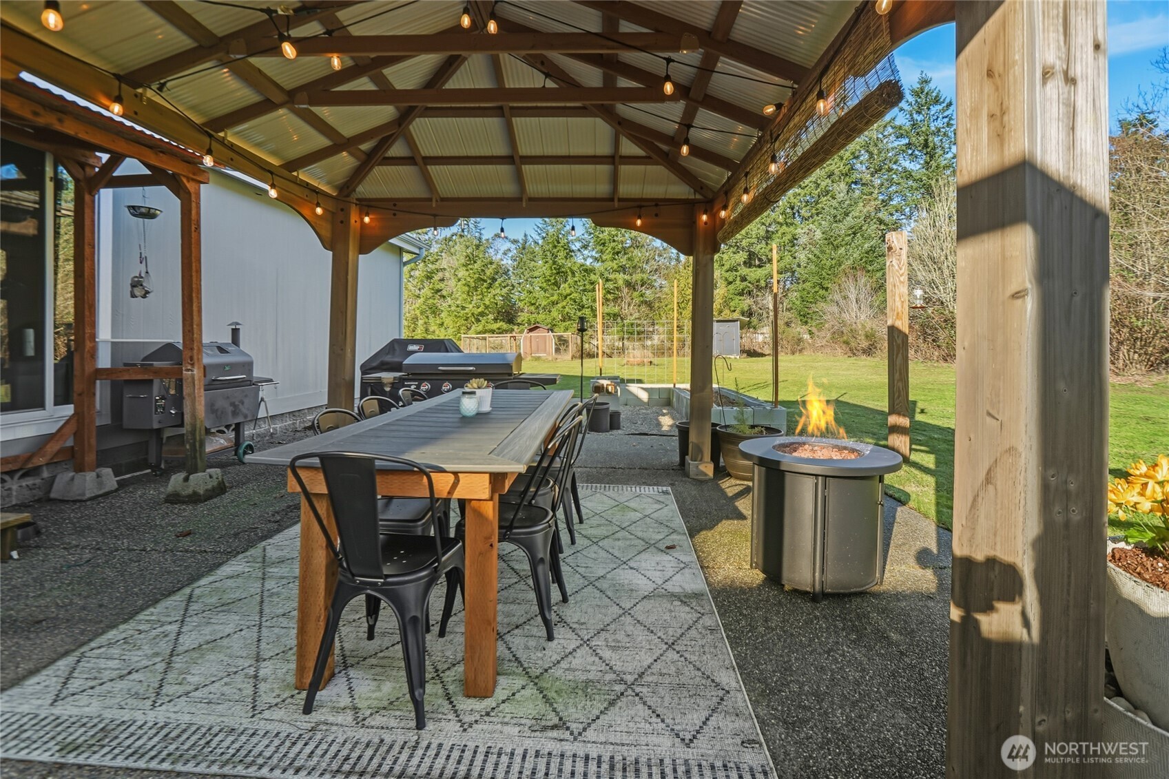 6509 176th Avenue Southwest Longbranch, WA 98351 - Photo 20 of 32 a view of an outdoor dining space with furniture
