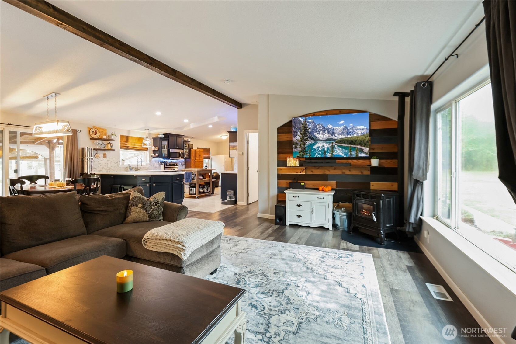 6509 176th Avenue Southwest Longbranch, WA 98351 - Photo 2 of 32 a living room with furniture and a flat screen tv