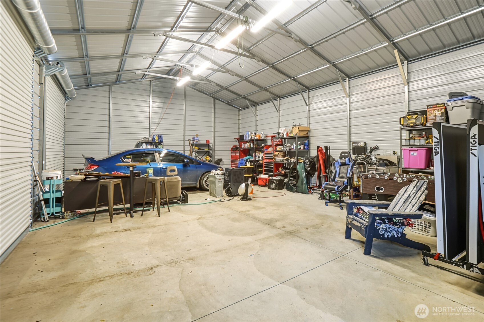 6509 176th Avenue Southwest Longbranch, WA 98351 - Photo 25 of 32 a view of a garage with a table and chairs
