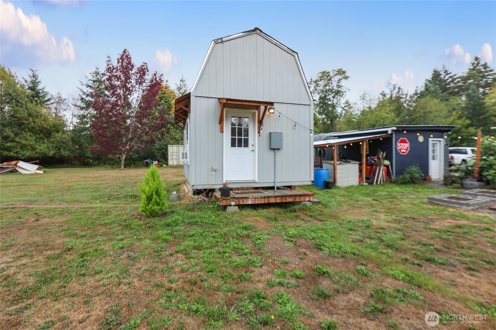 6509 176th Avenue Southwest Longbranch, WA 98351 - Photo 26 of 32 a view of a house with backyard and sitting area