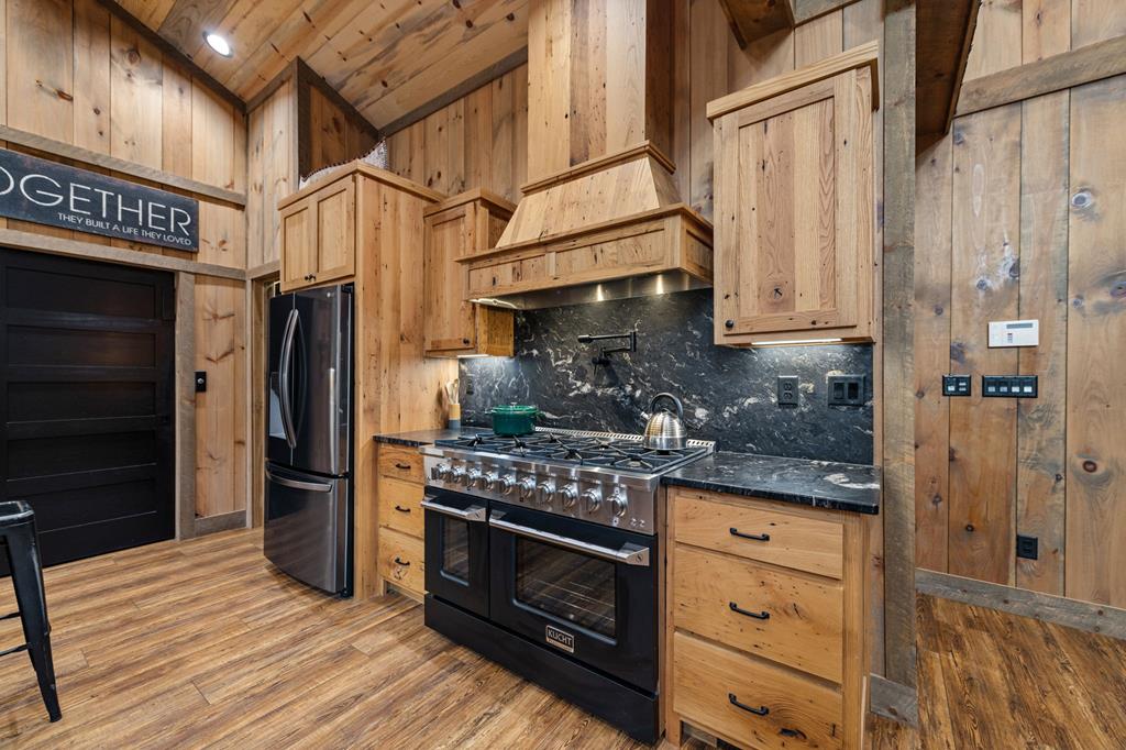 164 Waterdance Trail Blue Ridge, GA 30513 - Photo 29 of 97 a kitchen with stainless steel appliances granite countertop a refrigerator and a stove top oven