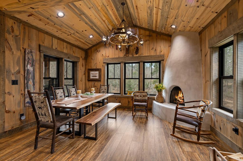 164 Waterdance Trail Blue Ridge, GA 30513 - Photo 32 of 97 a view of a dining room with furniture window and wooden floor