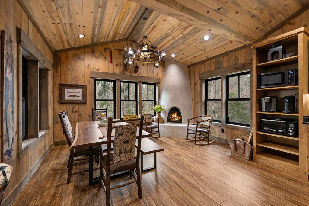 164 Waterdance Trail Blue Ridge, GA 30513 - Photo 33 of 97 a view of a dining room with furniture window and wooden floor