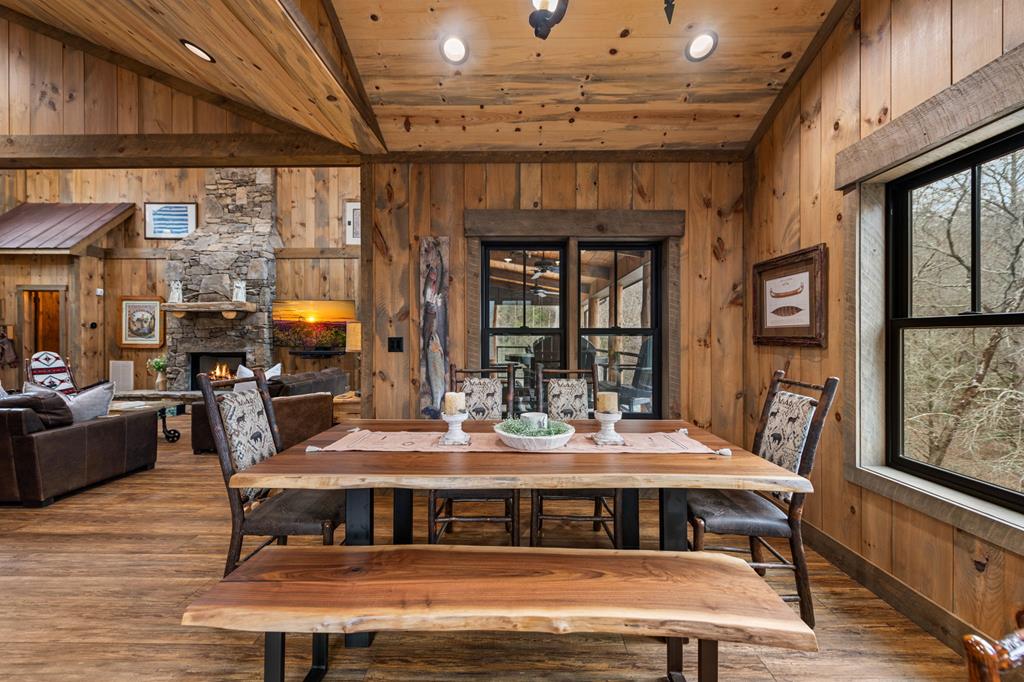 164 Waterdance Trail Blue Ridge, GA 30513 - Photo 36 of 97 a view of a dining room with furniture window and wooden floor