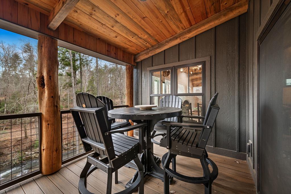 164 Waterdance Trail Blue Ridge, GA 30513 - Photo 42 of 97 a view of a dining room with furniture and wooden floor