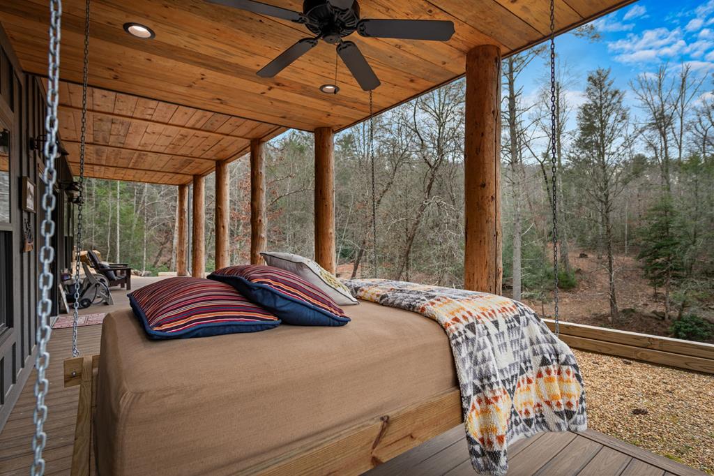 164 Waterdance Trail Blue Ridge, GA 30513 - Photo 73 of 97 a bedroom with a bed and a window