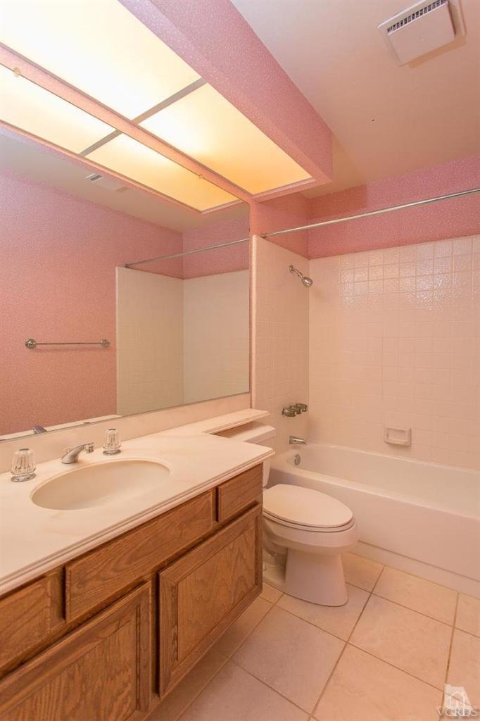 13681 Bear Valley Road Moorpark, CA 93021 - Photo 19 of 33 a bathroom with a sink a toilet and shower
