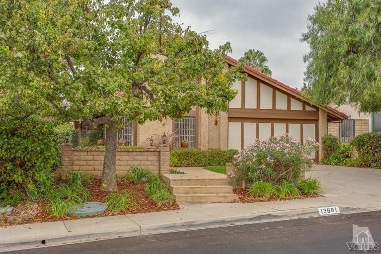 13681 Bear Valley Road Moorpark, CA 93021 - Photo 3 of 33 a front view of a house with a garden