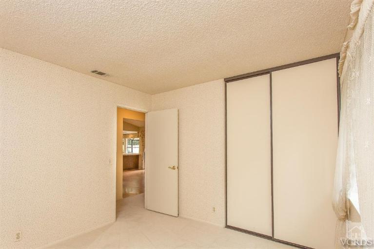 13681 Bear Valley Road Moorpark, CA 93021 - Photo 21 of 33 a view of an empty room with wooden floor