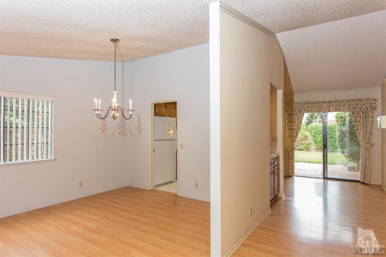 13681 Bear Valley Road Moorpark, CA 93021 - Photo 9 of 33 a view of empty room with wooden floor and fan