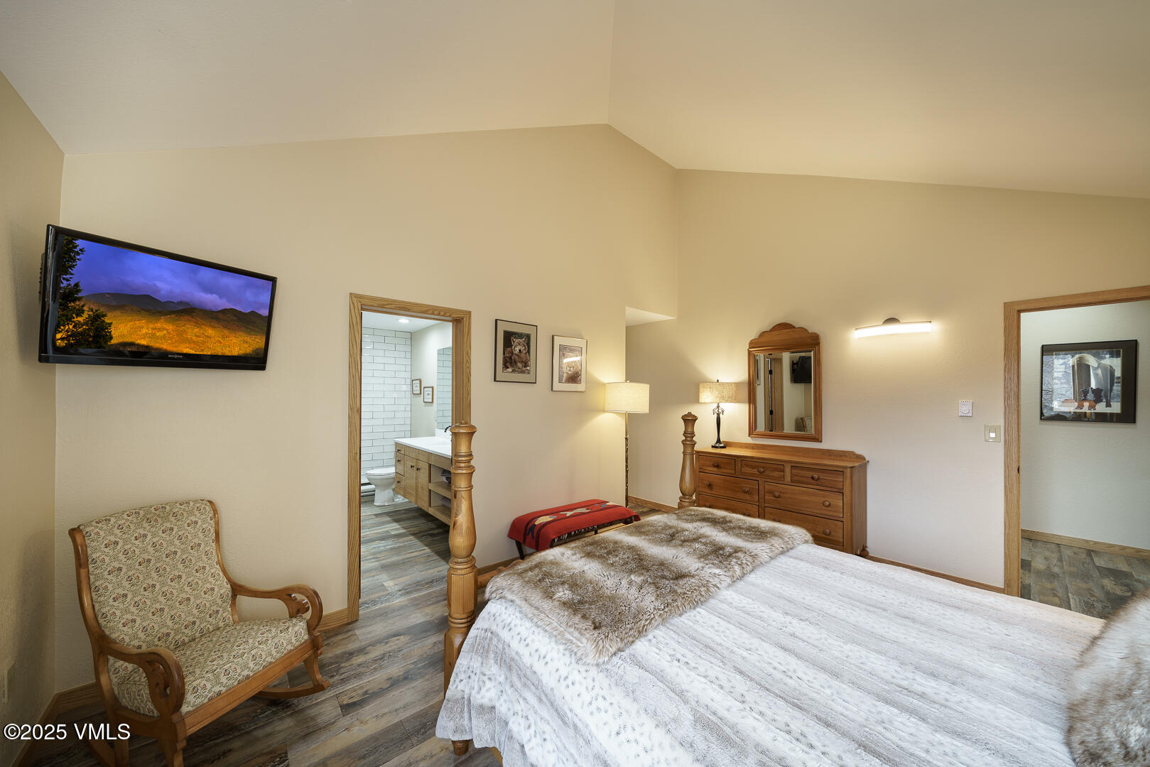 1121 Berry Creek Road, Unit B3 Edwards, CO 81632 - Photo 11 of 38 a bedroom with a bed and wooden floor