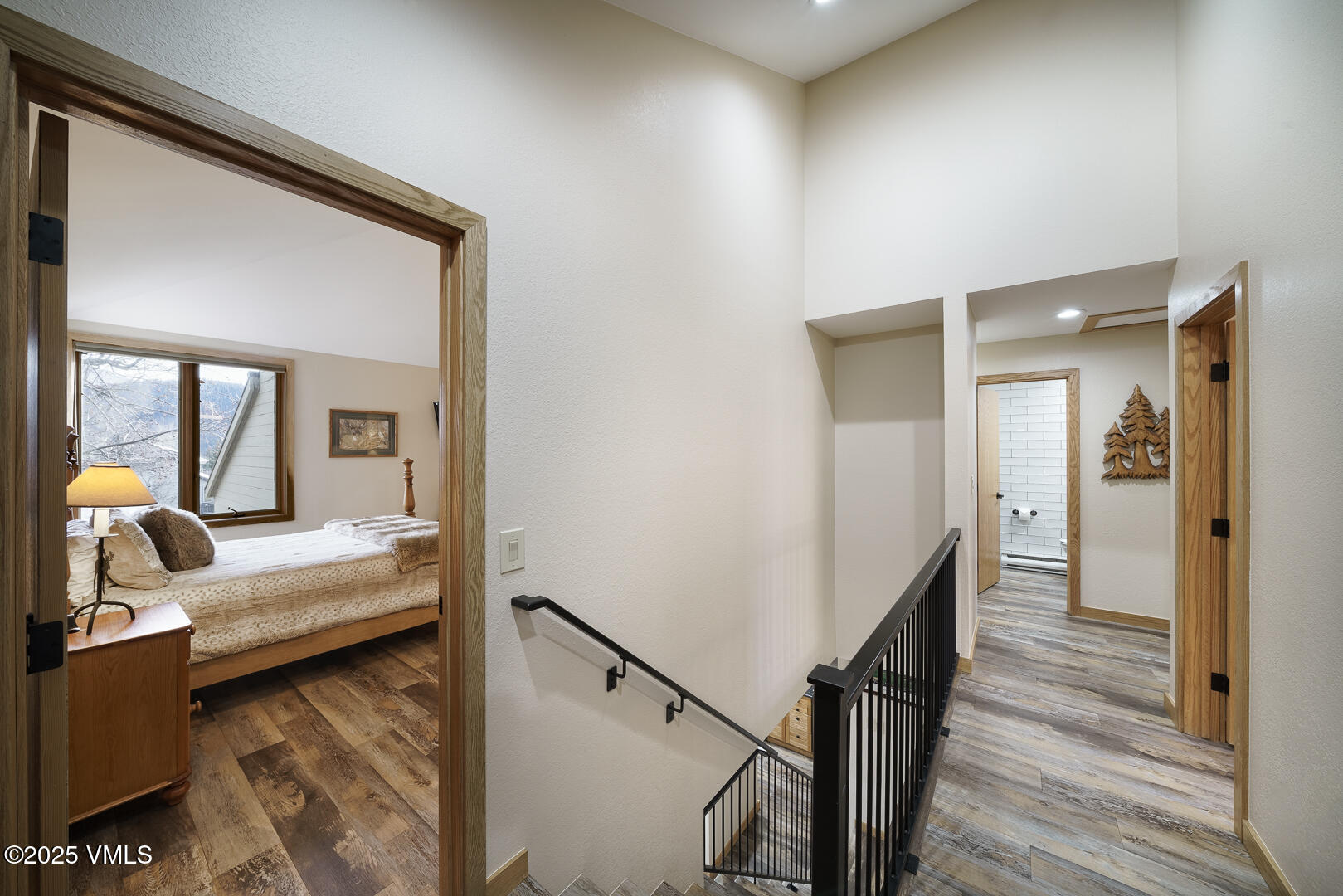 1121 Berry Creek Road, Unit B3 Edwards, CO 81632 - Photo 16 of 38 a bedroom with wooden floor