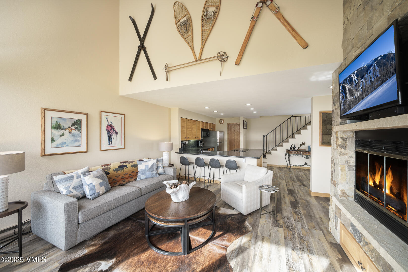 1121 Berry Creek Road, Unit B3 Edwards, CO 81632 - Photo 2 of 38 a living room with furniture and a fireplace