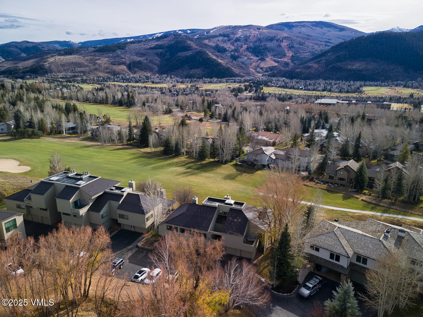 1121 Berry Creek Road, Unit B3 Edwards, CO 81632 - Photo 25 of 38 a view of a swimming pool and mountains in the background