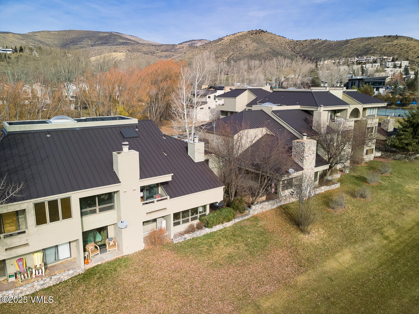 1121 Berry Creek Road, Unit B3 Edwards, CO 81632 - Photo 29 of 38 an aerial view of residential houses with outdoor space and trees