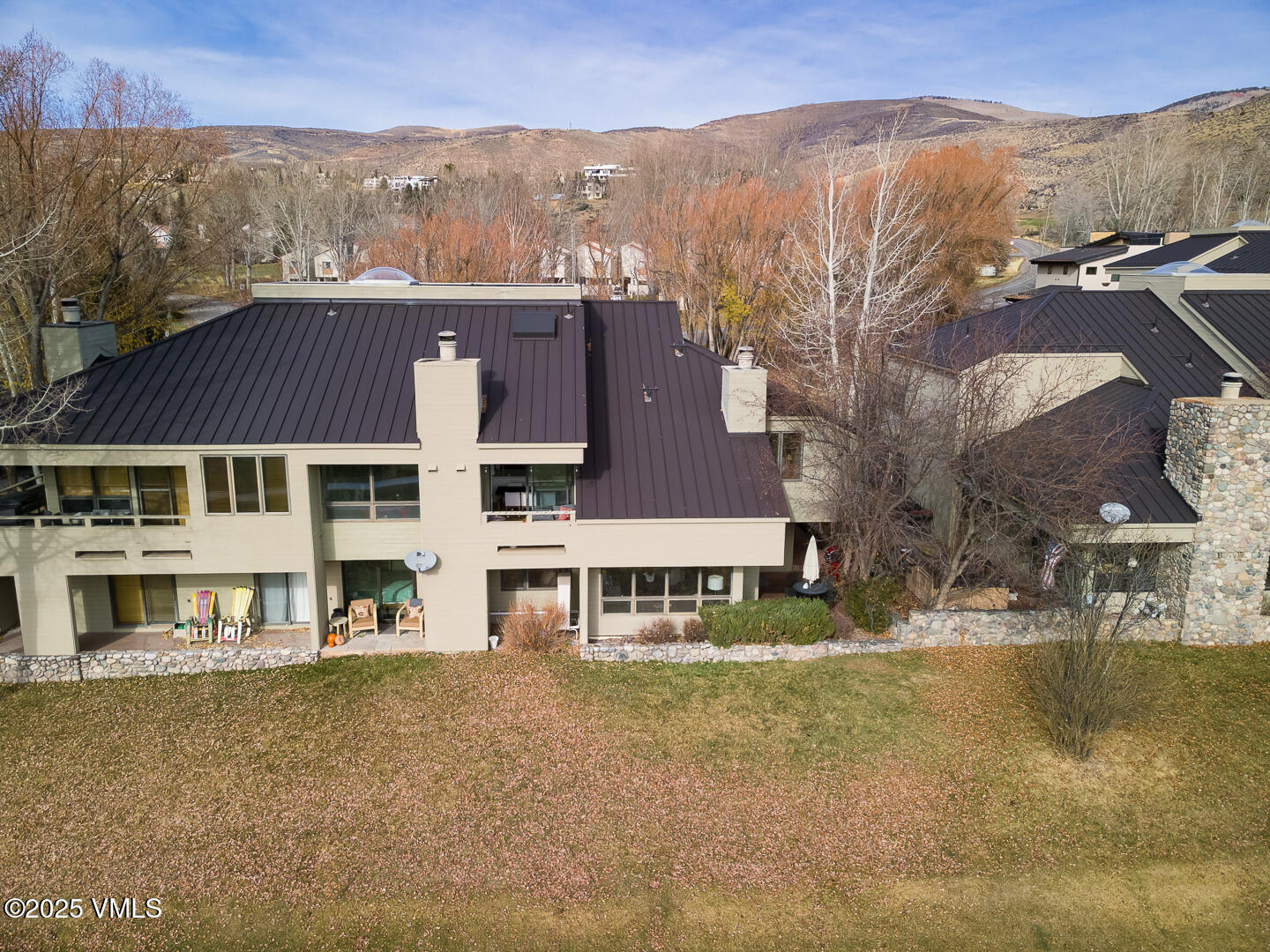 1121 Berry Creek Road, Unit B3 Edwards, CO 81632 - Photo 30 of 38 a aerial view of a house with a yard