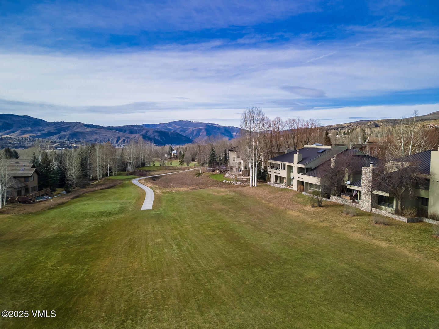 1121 Berry Creek Road, Unit B3 Edwards, CO 81632 - Photo 32 of 38 a view of a swimming pool with an outdoor seating and a garden