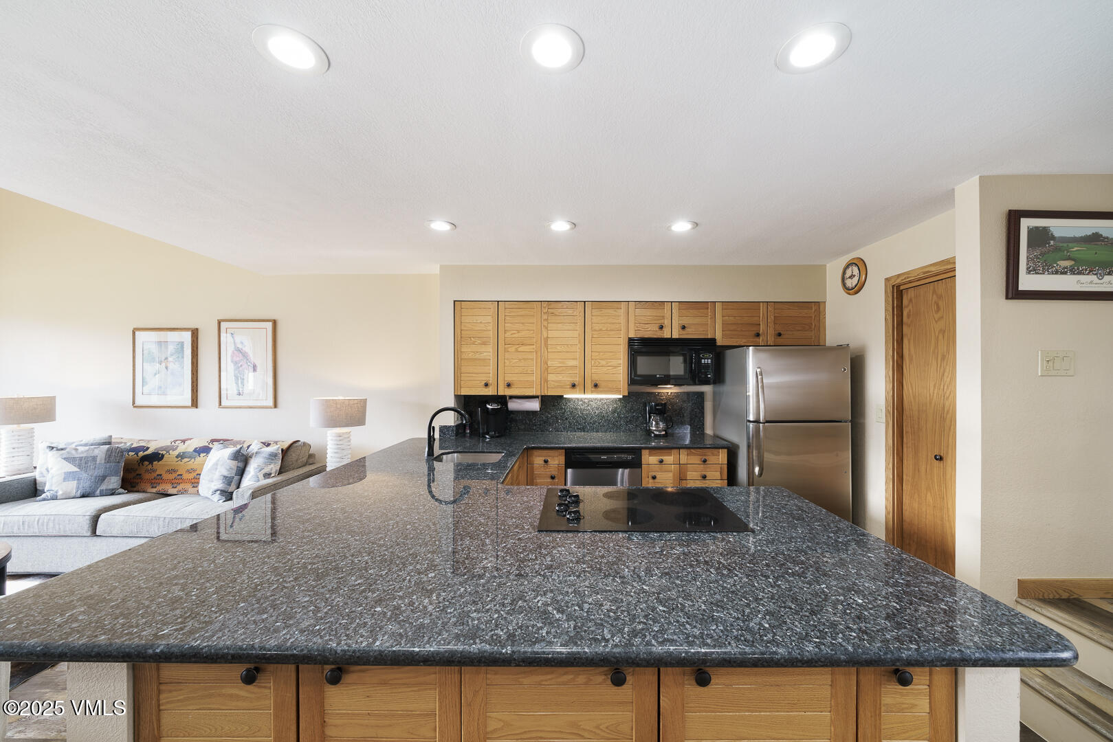 1121 Berry Creek Road, Unit B3 Edwards, CO 81632 - Photo 7 of 38 a kitchen with stainless steel appliances granite countertop a sink stove and refrigerator