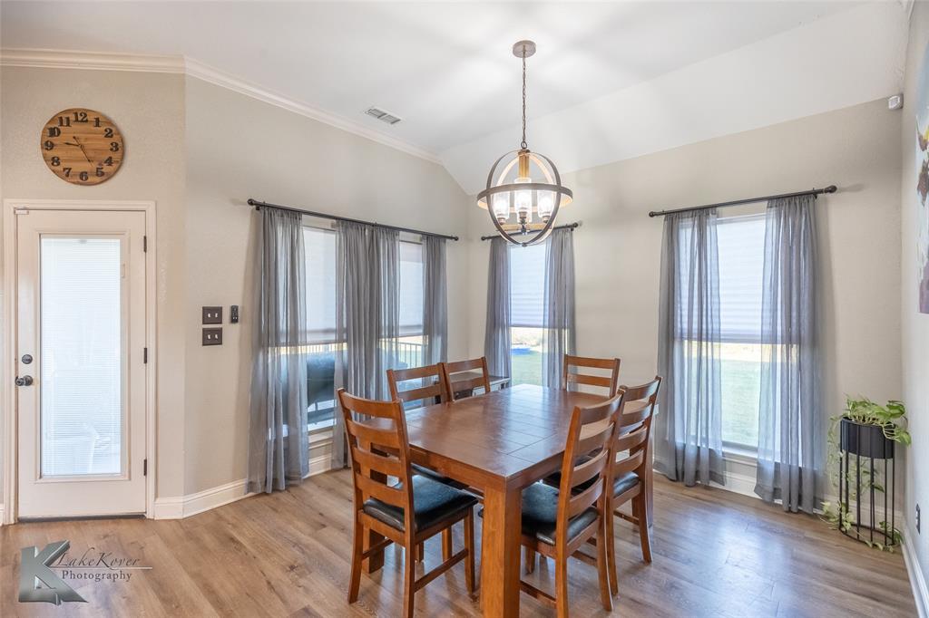 138 Lisa Lane Tuscola, TX 79562 - Photo 17 of 38 a view of a dining room with furniture window and wooden floor