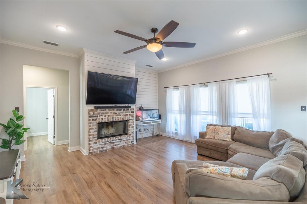 138 Lisa Lane Tuscola, TX 79562 - Photo 5 of 38 a living room with furniture fireplace and flat screen tv