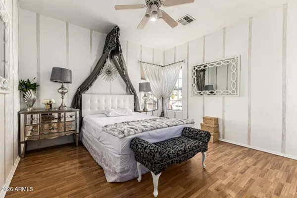 a bedroom with a bed furniture and a window