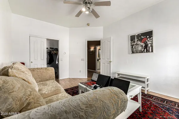 a bedroom with a bed and a chandelier