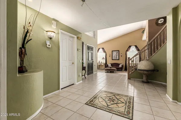 a lobby with furniture and rug