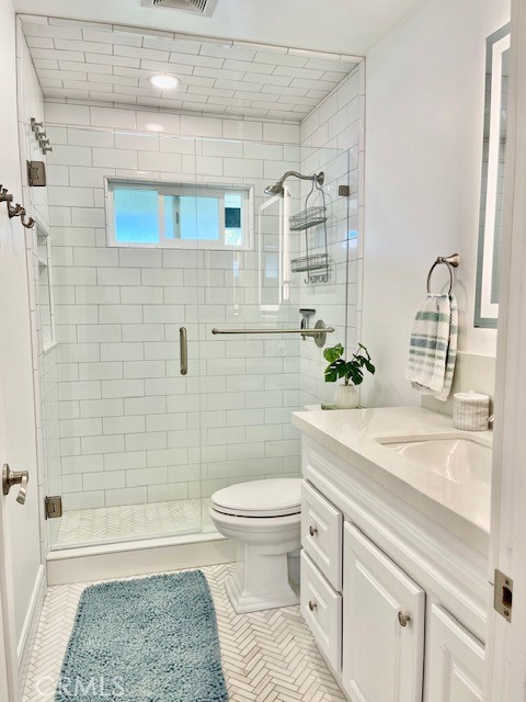 3080 Lincoln Street, Unit 17 Carlsbad, CA 92008 - Photo 15 of 26 a bathroom with a sink a toilet and shower