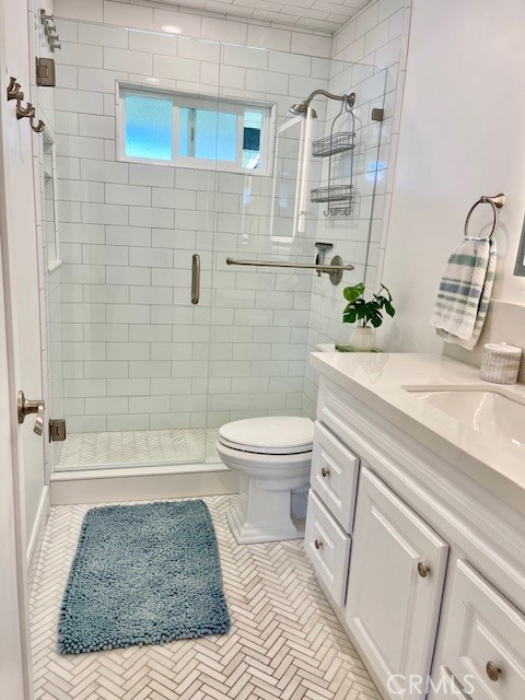 3080 Lincoln Street, Unit 17 Carlsbad, CA 92008 - Photo 16 of 26 a bathroom with a sink toilet and shower