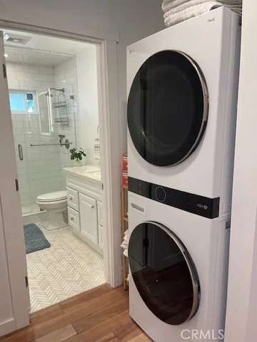 a view of a hallway with washer and dryer