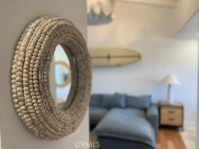 a living room with a couch and a wooden floor