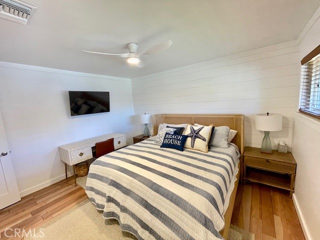 3080 Lincoln Street, Unit 17 Carlsbad, CA 92008 - Photo 21 of 26 a bedroom with a bed and a flat screen tv