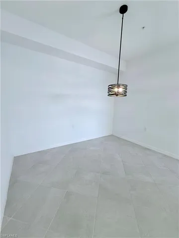 a view of a room with a hanging light