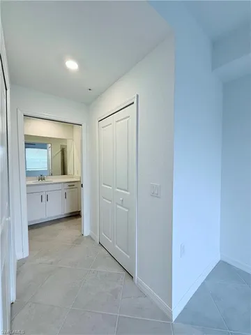 a bathroom with a toilet sink a mirror and window