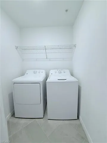 a kitchen with kitchen island stainless steel appliances a counter space and cabinets