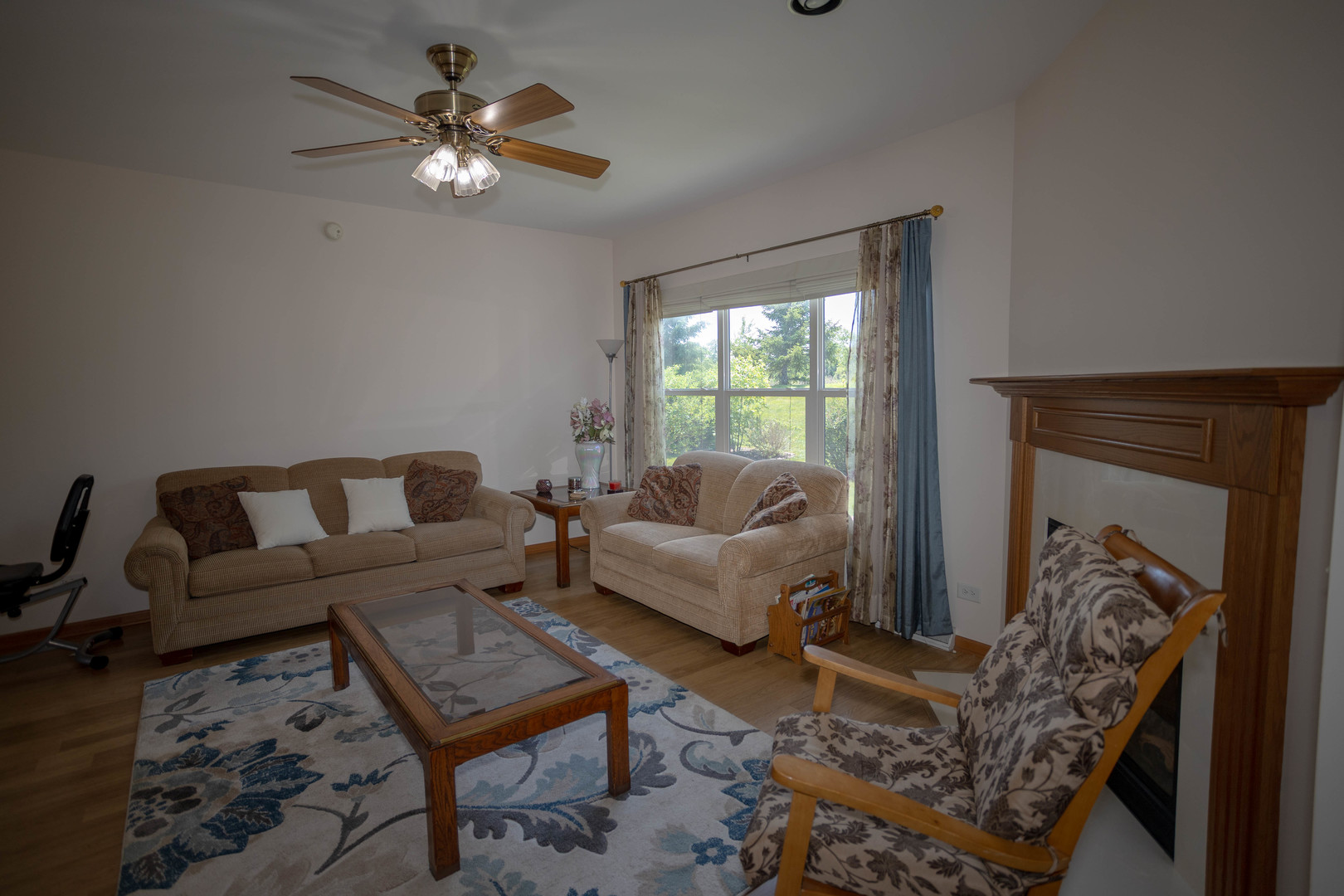 212 Rodeo Drive, Unit 2179 Grayslake, IL 60030 - Photo 15 of 31 a living room with furniture a chandelier and a fireplace