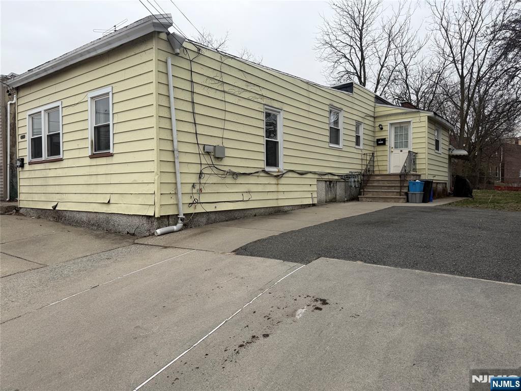 92 Naples Place Garfield, NJ 07026 - Photo 2 of 3 a view of a house with a yard