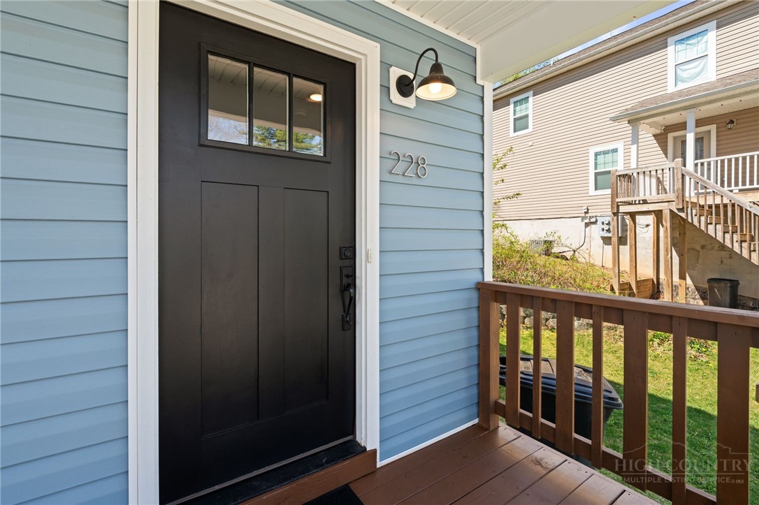 228 Stratford Lane Boone, NC 28607 - Photo 5 of 33 a view of a balcony with a door