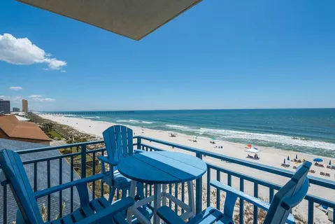 a view of a swimming pool with a table and chairs