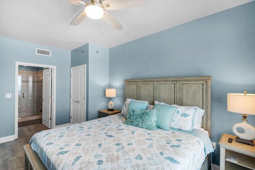 16701 Front Beach Road, Unit 401 Panama City Beach, FL 32413 - Photo 16 of 22 a bedroom with a bed and a lamp