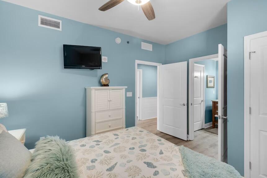 16701 Front Beach Road, Unit 401 Panama City Beach, FL 32413 - Photo 22 of 22 a bedroom with a bed and a flat screen tv