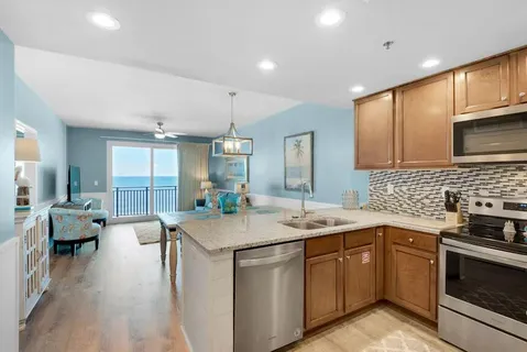 a kitchen with a sink stove and cabinets