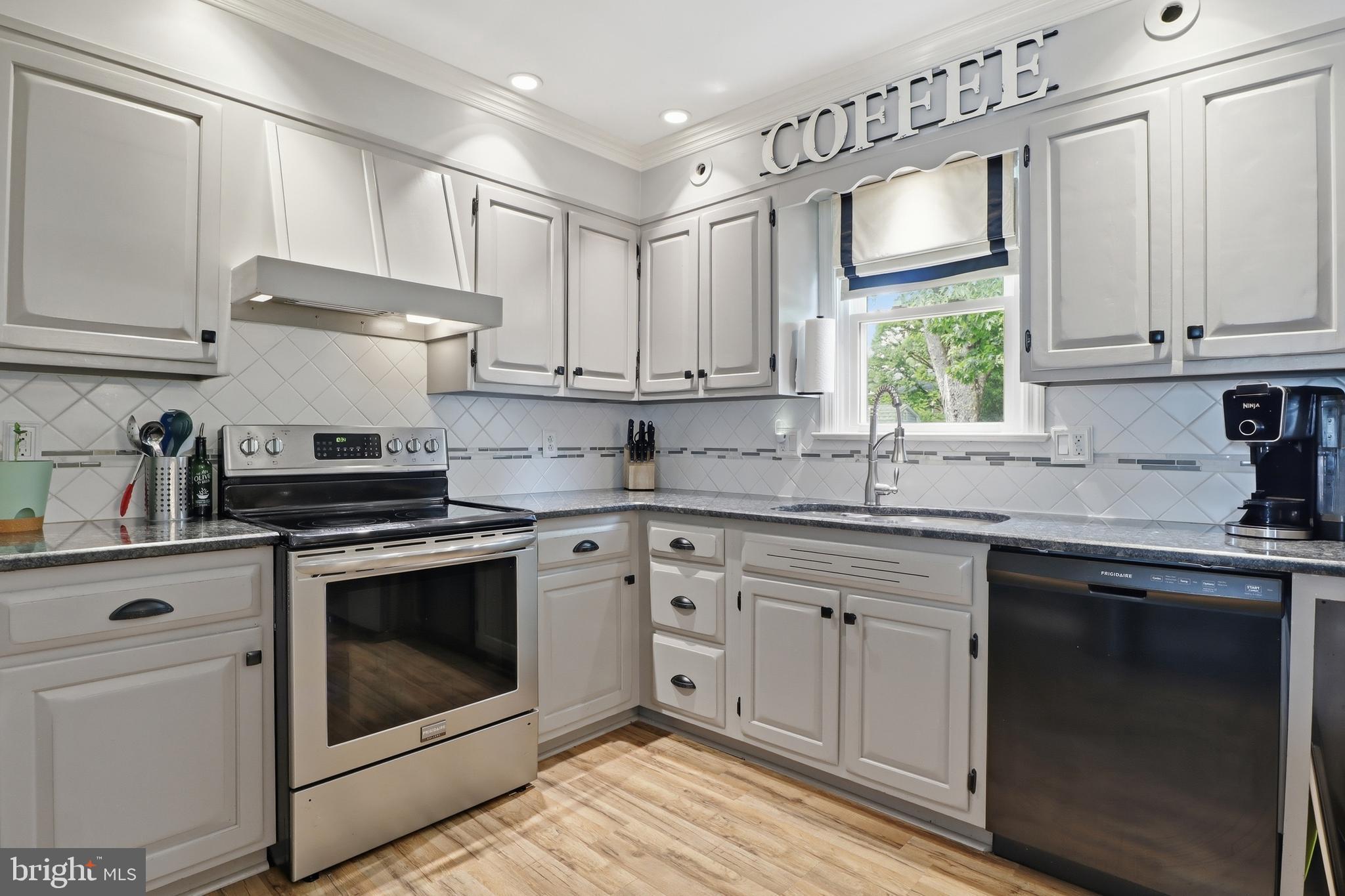 1072 Lambley Road Landisville, PA 17538 - Photo 35 of 46 a kitchen with cabinets stainless steel appliances a sink and a stove