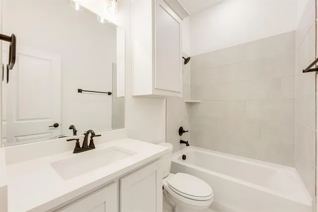 a bathroom with a sink a toilet and a bathtub