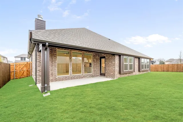 a view of an house with backyard porch and wooden floor