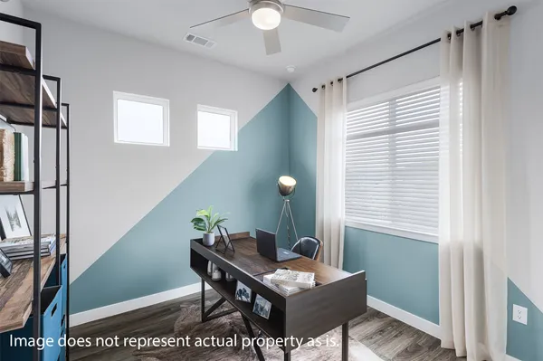 a workspace with furniture and window