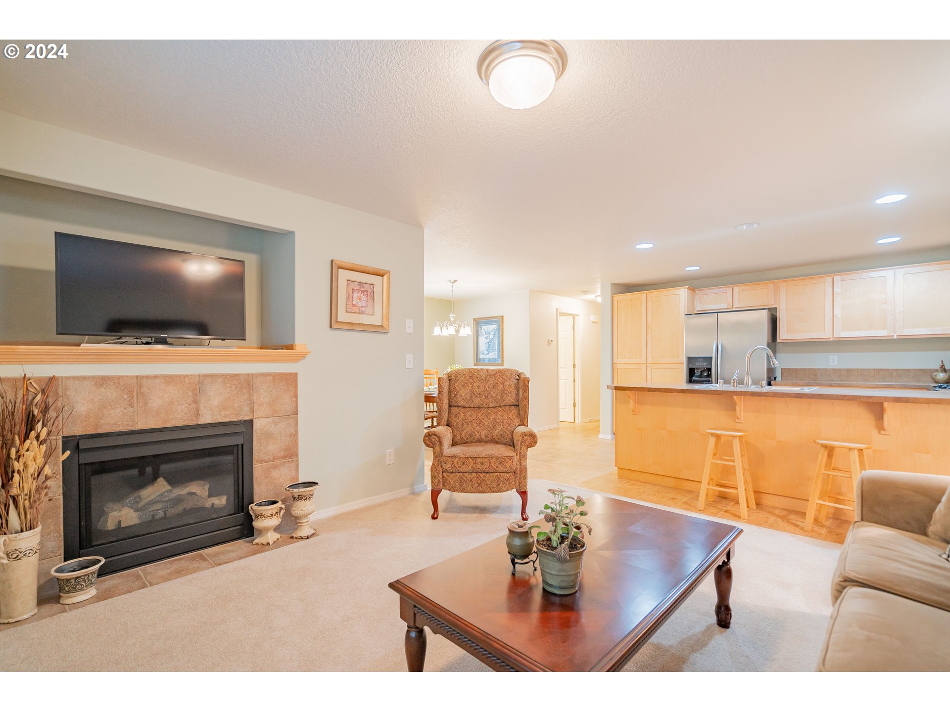 1420 Southeast 5th Way Battle Ground, WA 98604 - Photo 11 of 32 a living room with furniture a flat screen tv and a fireplace