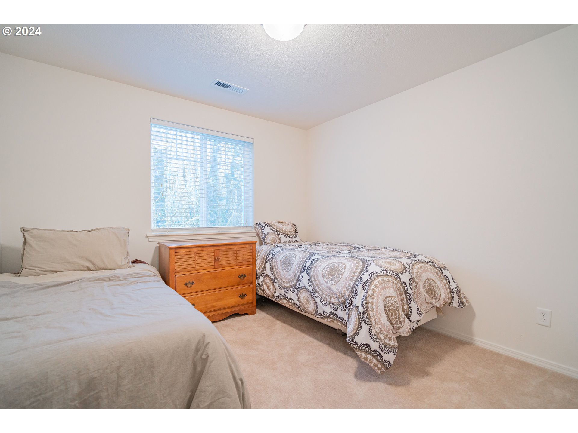 1420 Southeast 5th Way Battle Ground, WA 98604 - Photo 24 of 32 a bedroom with a bed and a night stand