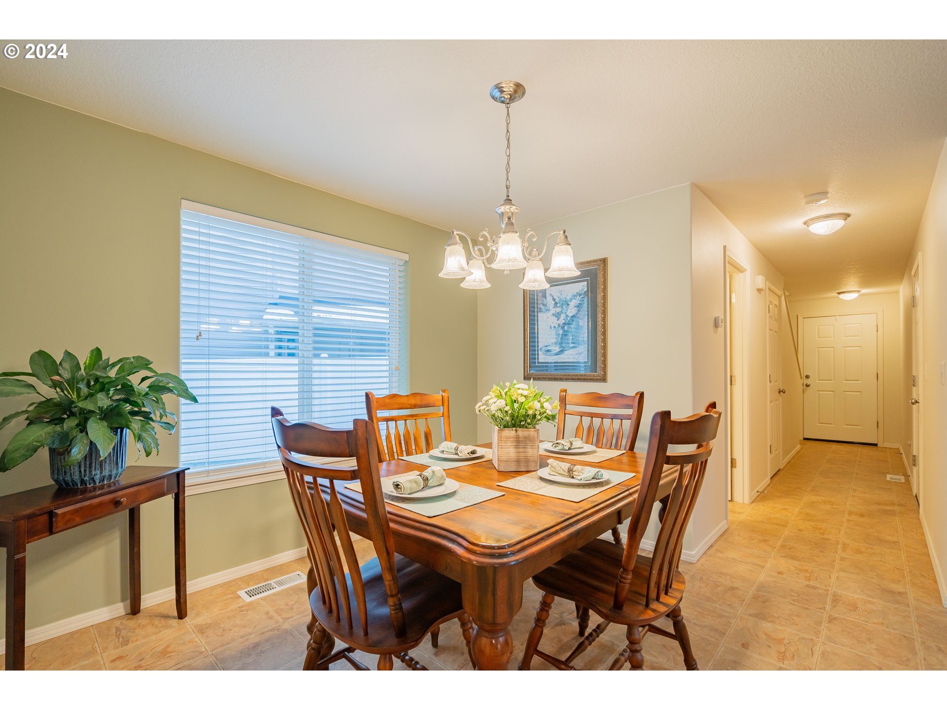 1420 Southeast 5th Way Battle Ground, WA 98604 - Photo 3 of 32 a view of a dining room with furniture and chandelier