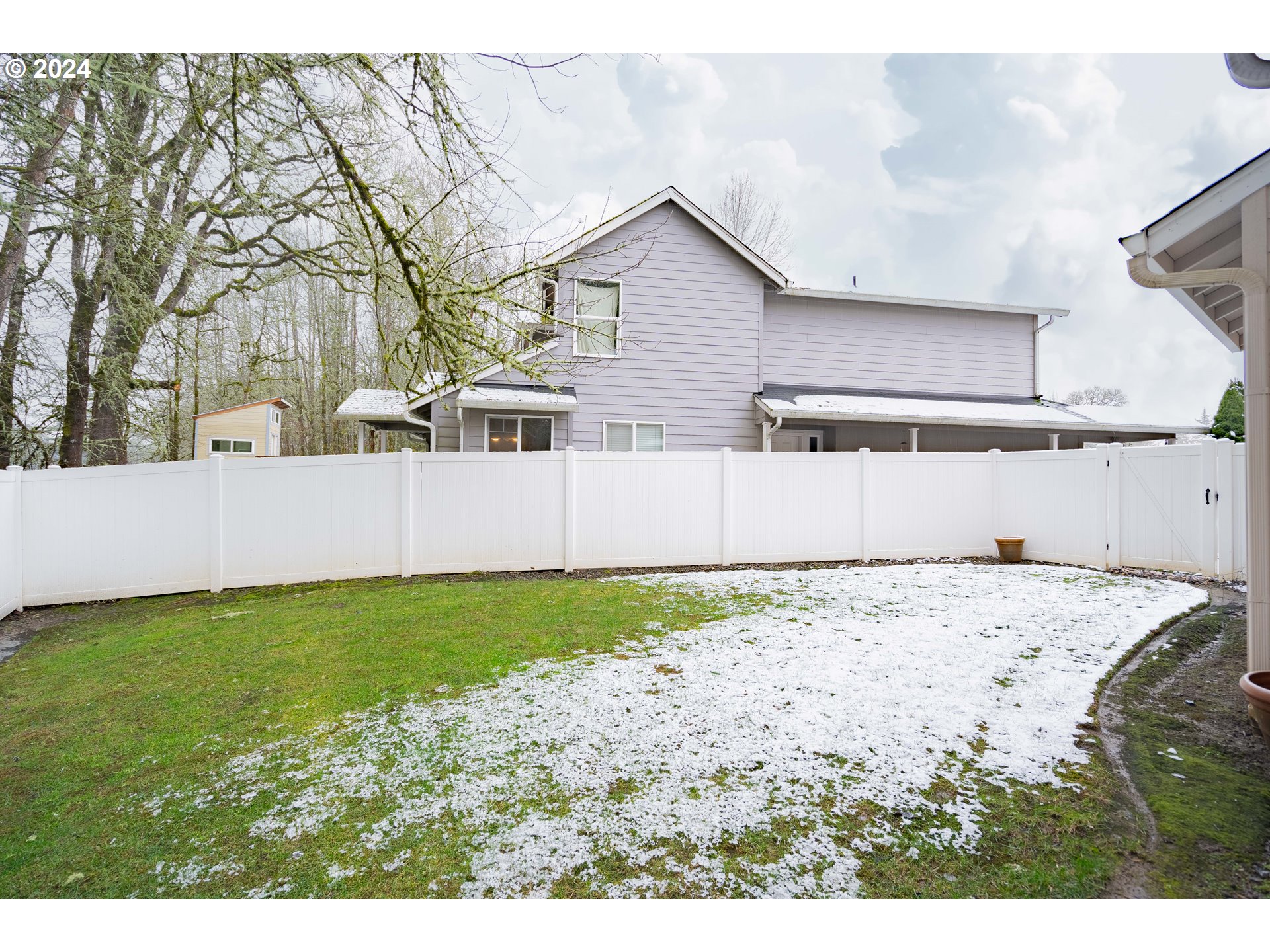 1420 Southeast 5th Way Battle Ground, WA 98604 - Photo 31 of 32 a view of a house with a snow on the yard and floor to ceiling window